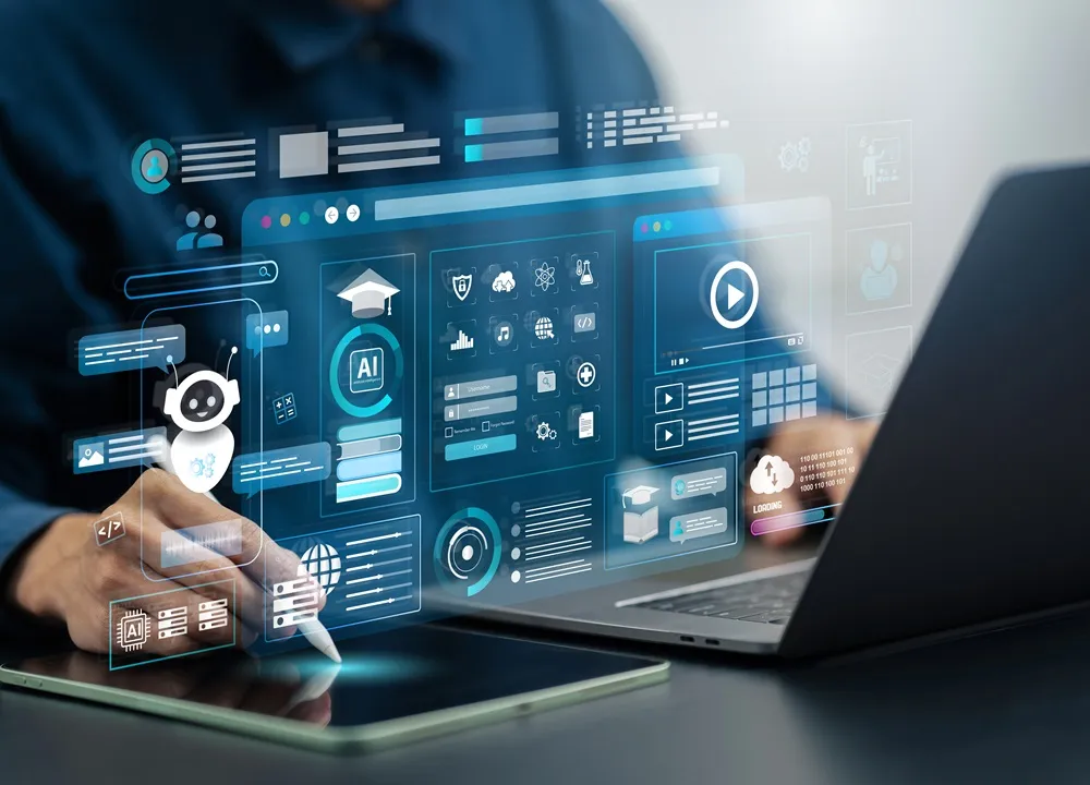 A person using a laptop and tablet with digital AI and education icons floating on the screen.