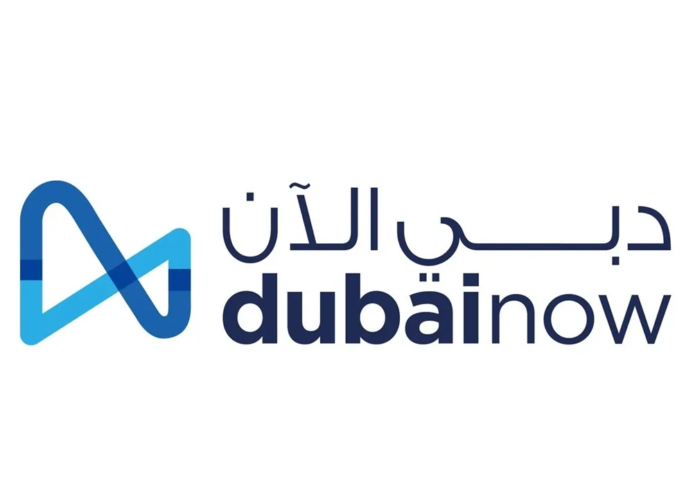 Dubai Now logo in blue tones with Arabic and English text.