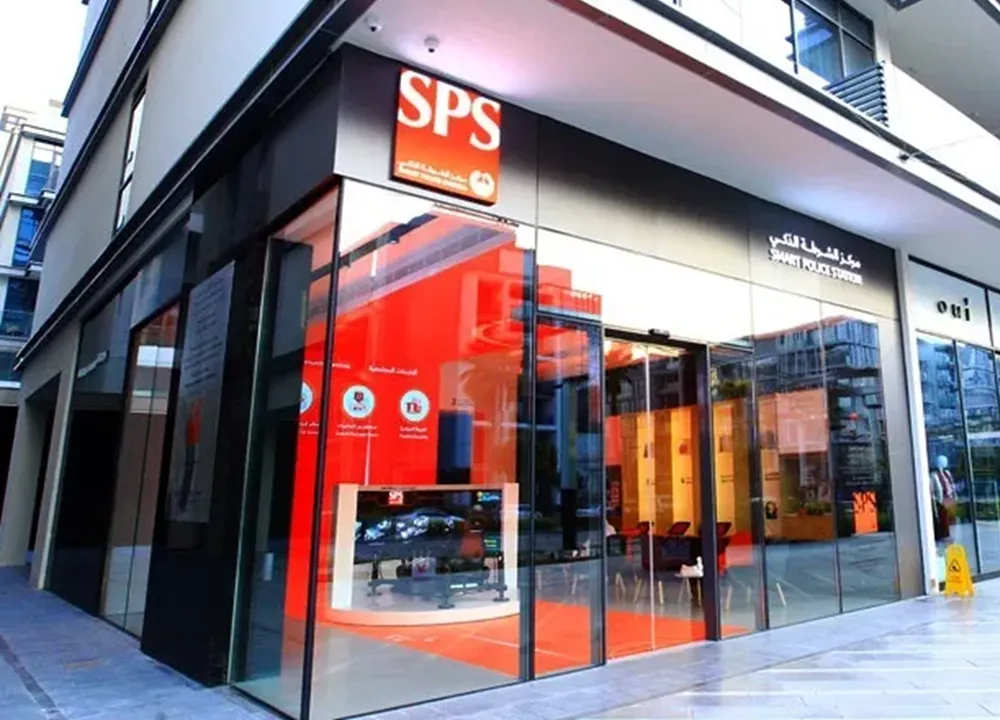 A modern Smart Police Station with glass walls and a bright red interior.