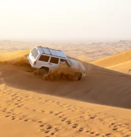  The image of a desert safari can be seen as a representation of the unique and exciting experiences that are available in Dubai.